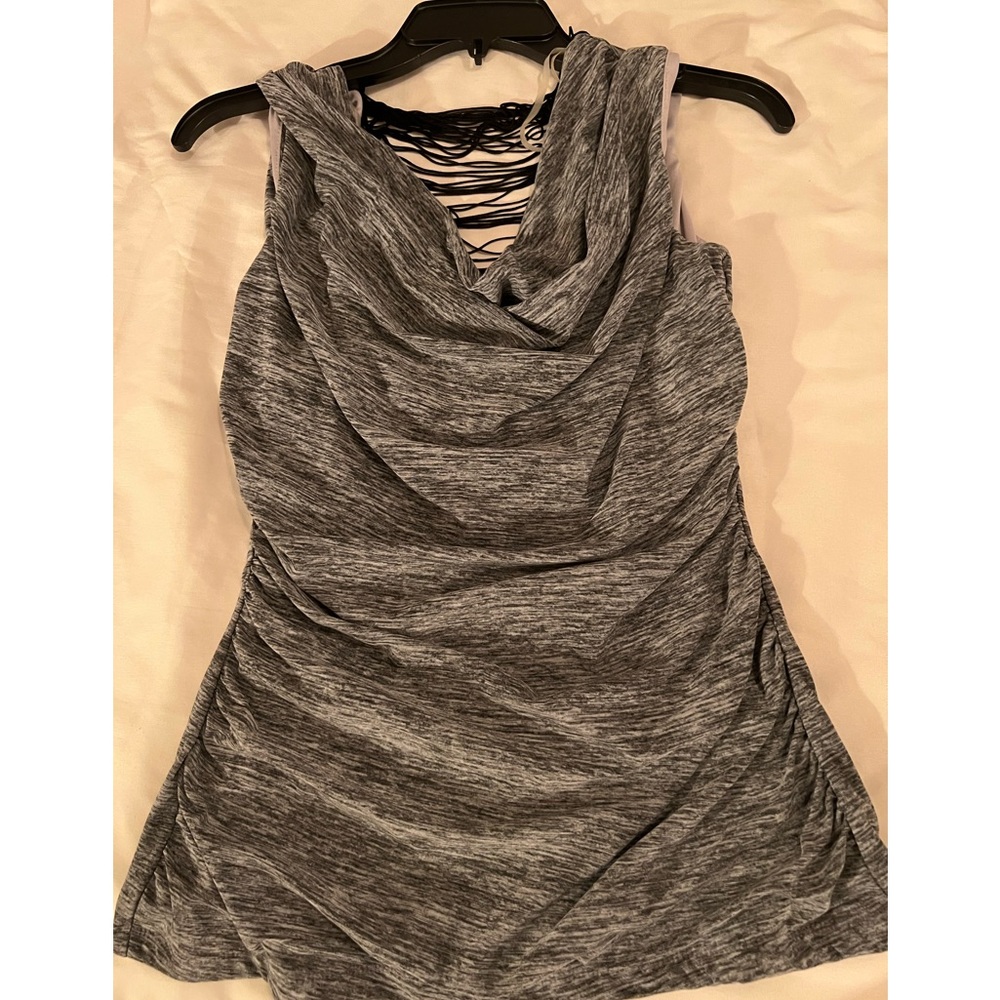 Tank Top with hang down fringe back.  Size medium.
